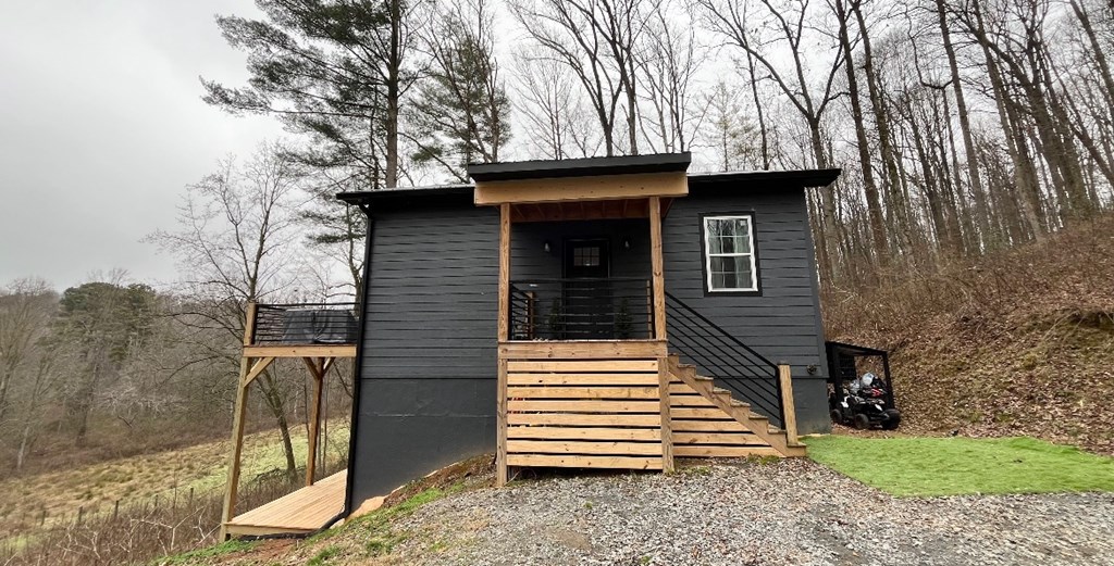 2086 Burnt Mountain Road Ellijay, GA 30536 - Photo 30 of 47 a view of a house with a yard