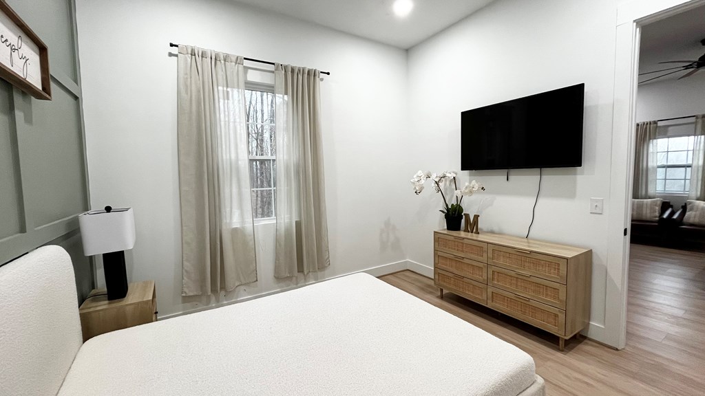 2086 Burnt Mountain Road Ellijay, GA 30536 - Photo 36 of 47 a bedroom with a bed and a flat screen tv