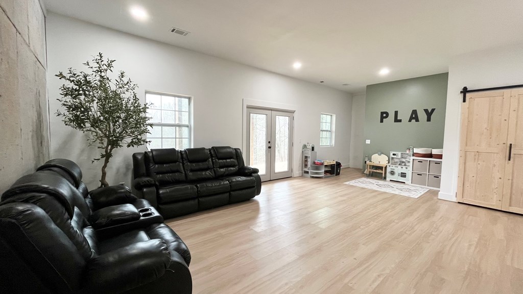2086 Burnt Mountain Road Ellijay, GA 30536 - Photo 37 of 47 a living room with furniture and a large window