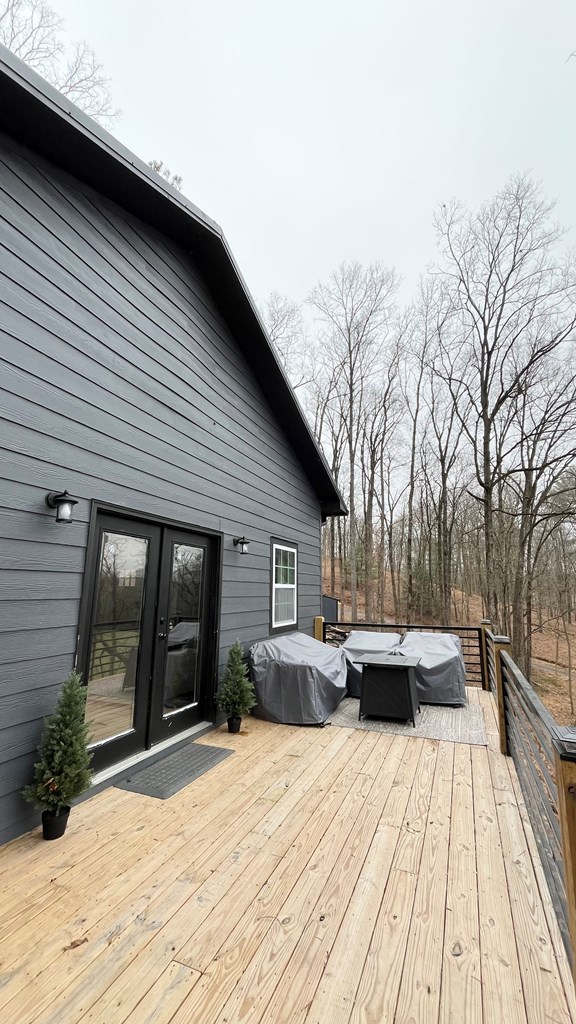 2086 Burnt Mountain Road Ellijay, GA 30536 - Photo 41 of 47 a backyard of a house with wooden floor and outdoor seating
