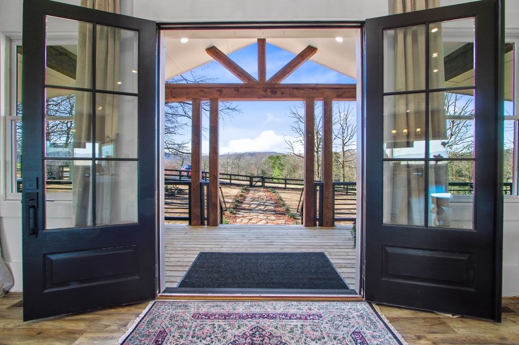 2086 Burnt Mountain Road Ellijay, GA 30536 - Photo 5 of 47 a living room with a large window and a table
