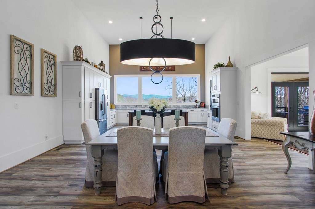 2086 Burnt Mountain Road Ellijay, GA 30536 - Photo 7 of 47 a view of a dining room with furniture and wooden floor
