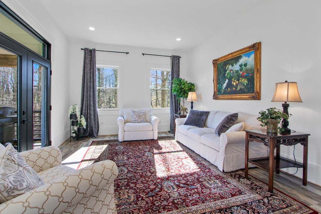 2086 Burnt Mountain Road Ellijay, GA 30536 - Photo 8 of 47 a living room with furniture and a rug