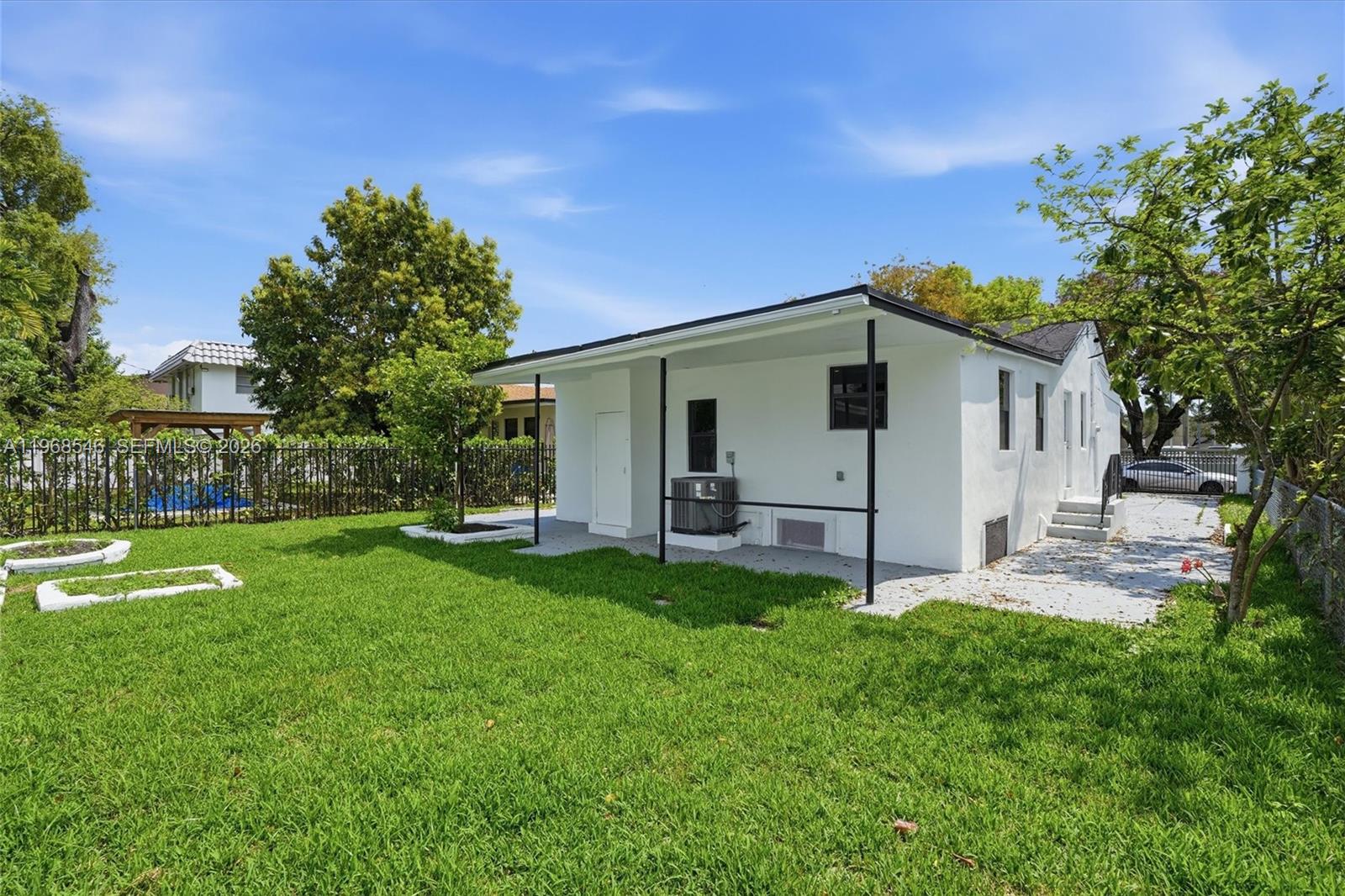 4237 Southwest 7th Street Miami, FL 33134 - Photo 27 of 31 a view of a house with a yard and sitting area