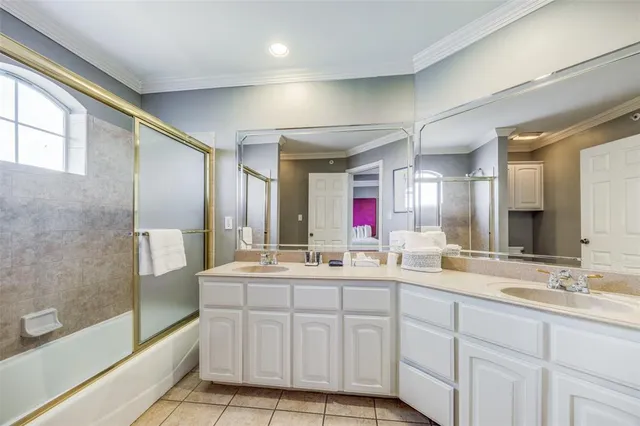 a bathroom with double sink and a mirror