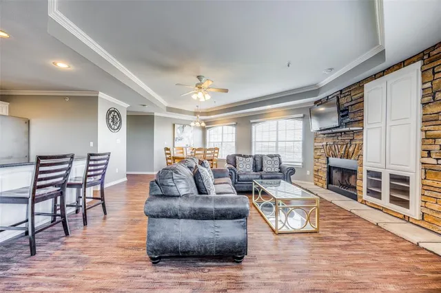 a living room with furniture and a fireplace