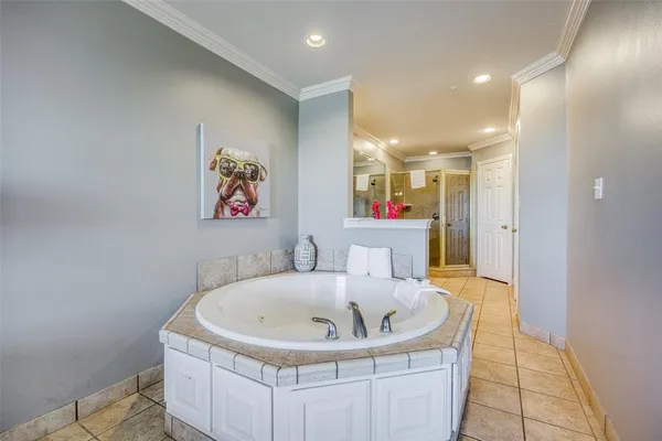 a bathroom with a tub and sink