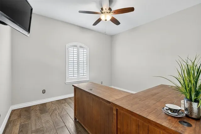 a view of room with window and a potted plant