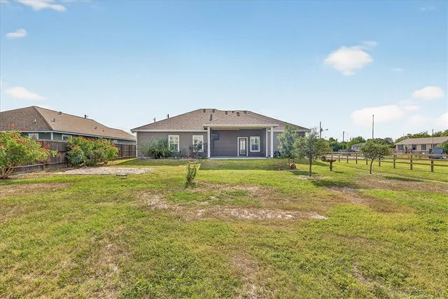 a view of a house with a big yard