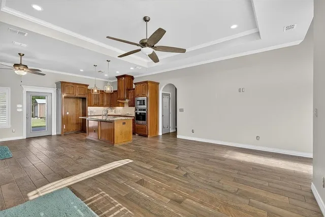 a view of a kitchen with a sink and a window
