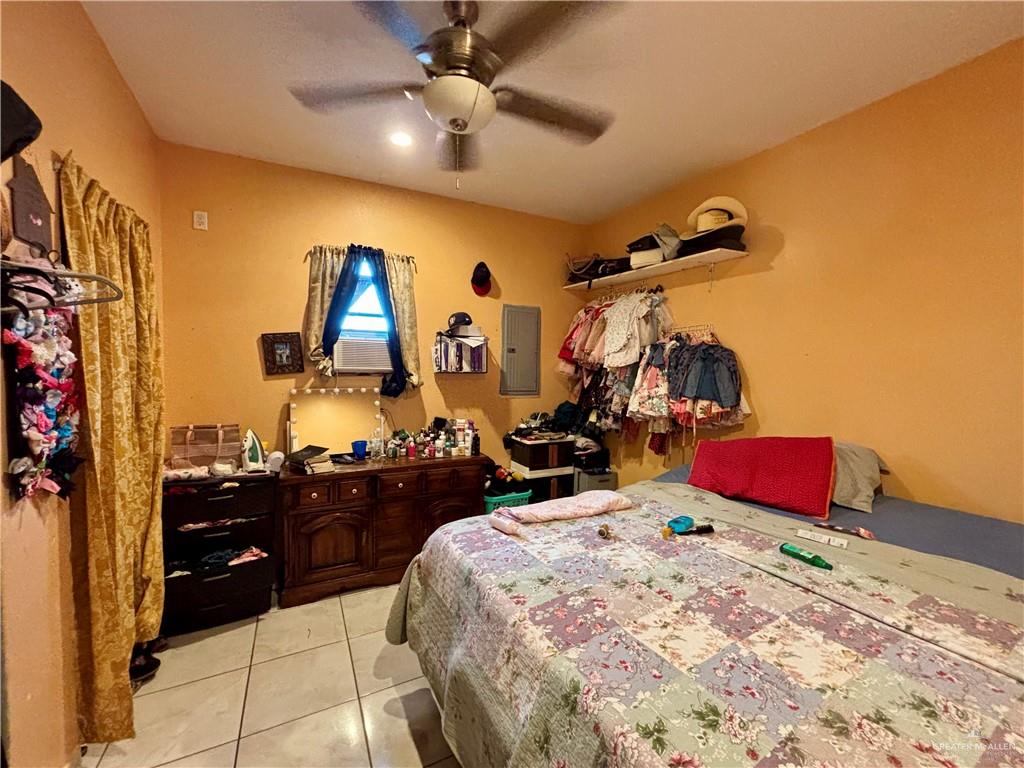 7408 Mackenzie Street Donna, TX 78537 - Photo 7 of 15 a bedroom with bed and cabinets