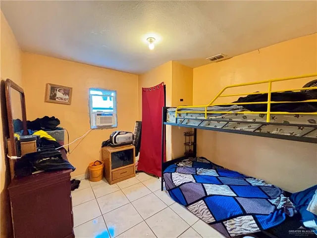 a room with gym equipment and a large window