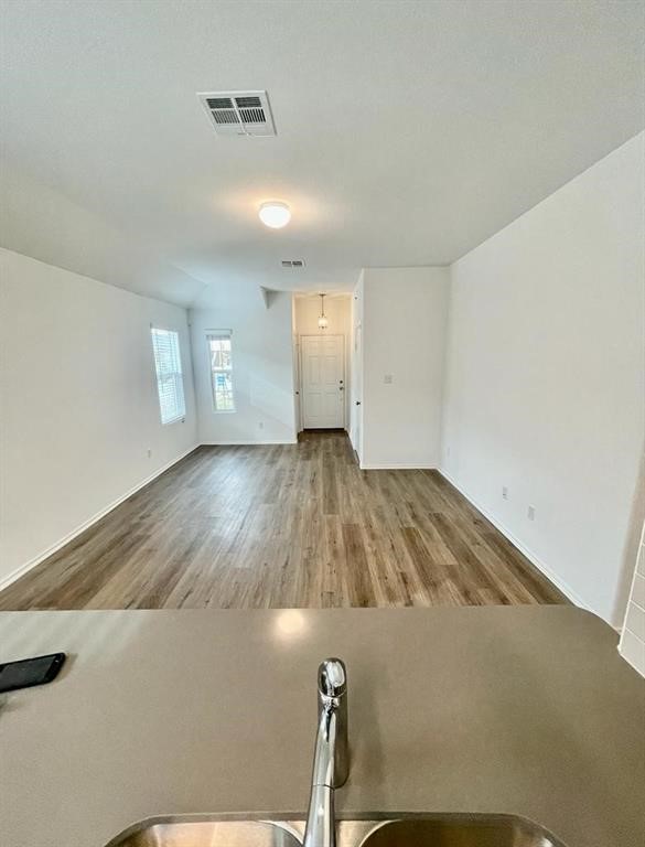 420 Perfect World Loop Jarrell, TX 76537 - Photo 16 of 17 a view of a room with wooden floor