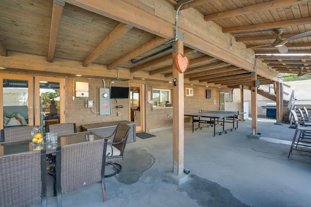 a view of a livingroom with dining room and furniture