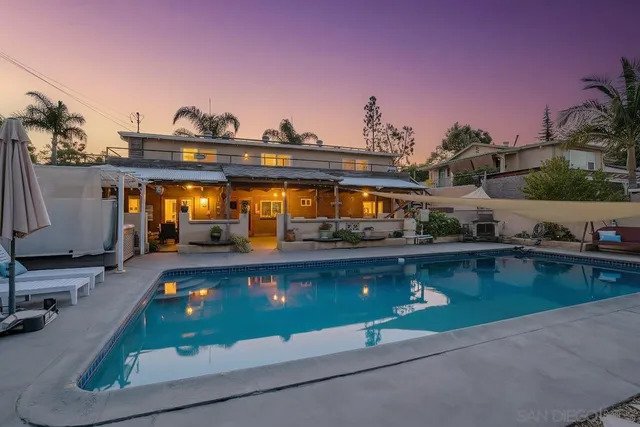 a view of swimming pool with outdoor seating