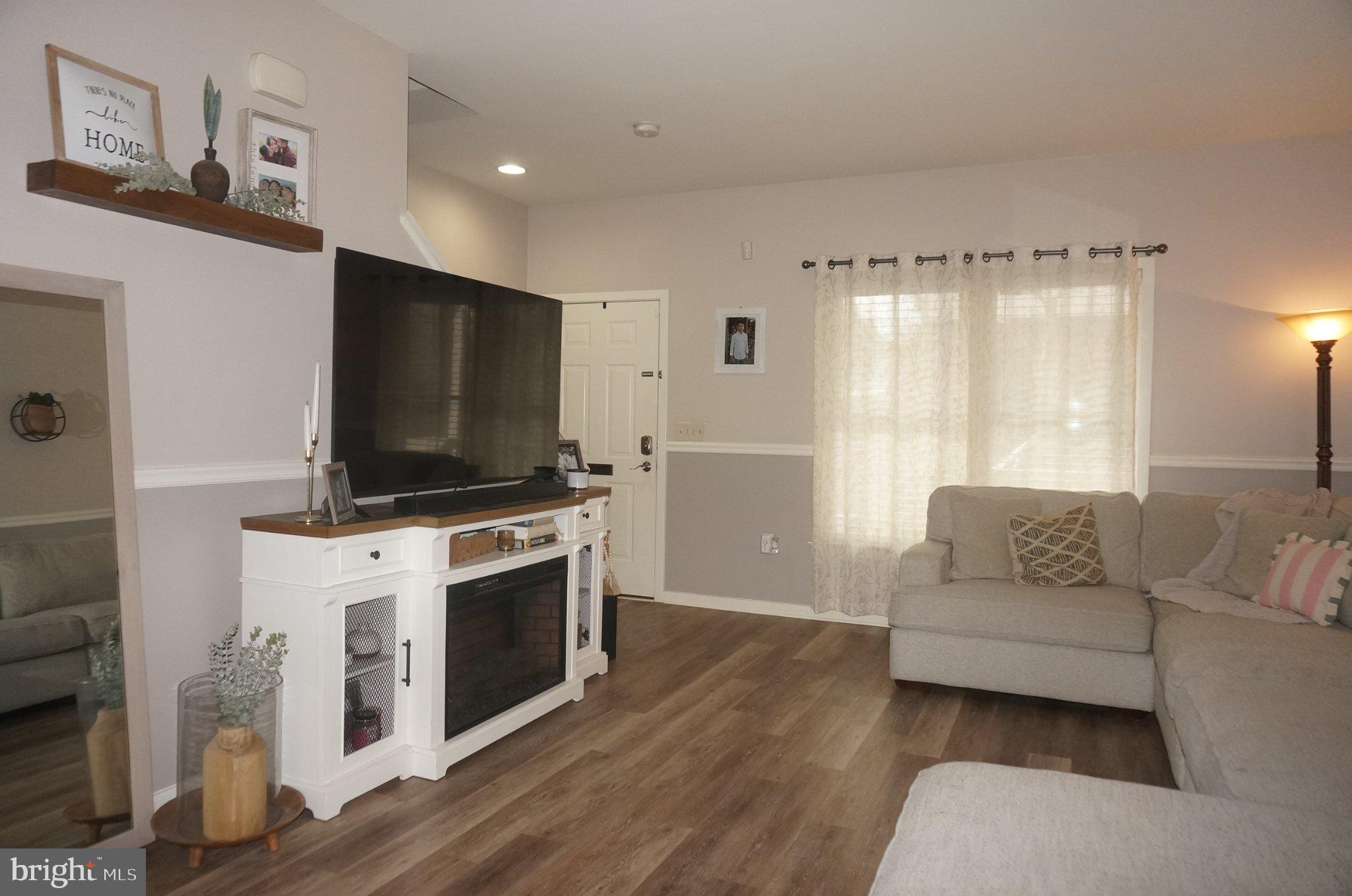 429 Locust Street Lancaster, PA 17602 - Photo 2 of 18 a living room with furniture and a flat screen tv