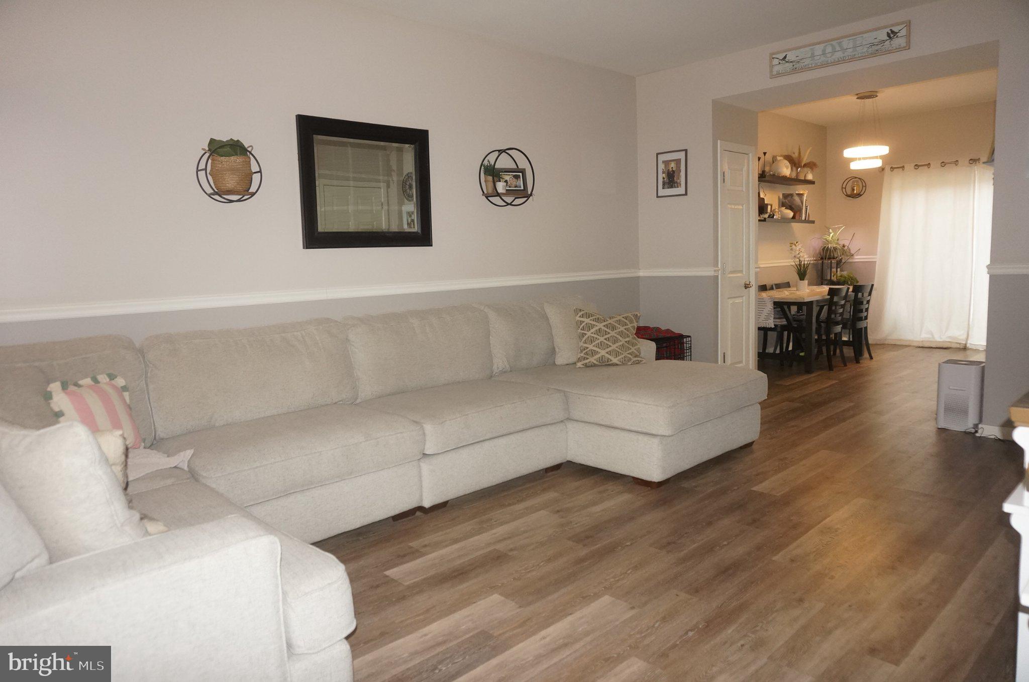 429 Locust Street Lancaster, PA 17602 - Photo 3 of 18 a living room with furniture and a wooden floor