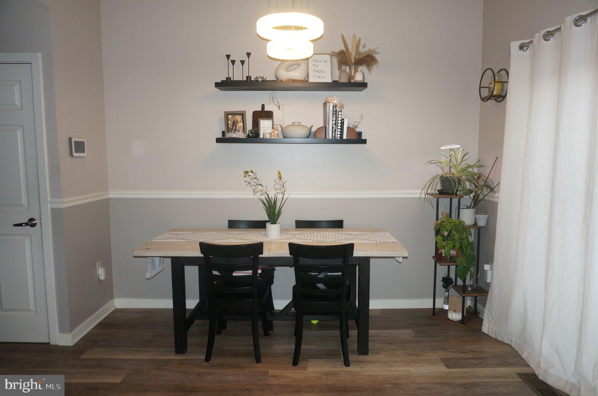 429 Locust Street Lancaster, PA 17602 - Photo 4 of 18 a view of a dining room with furniture and wooden floor