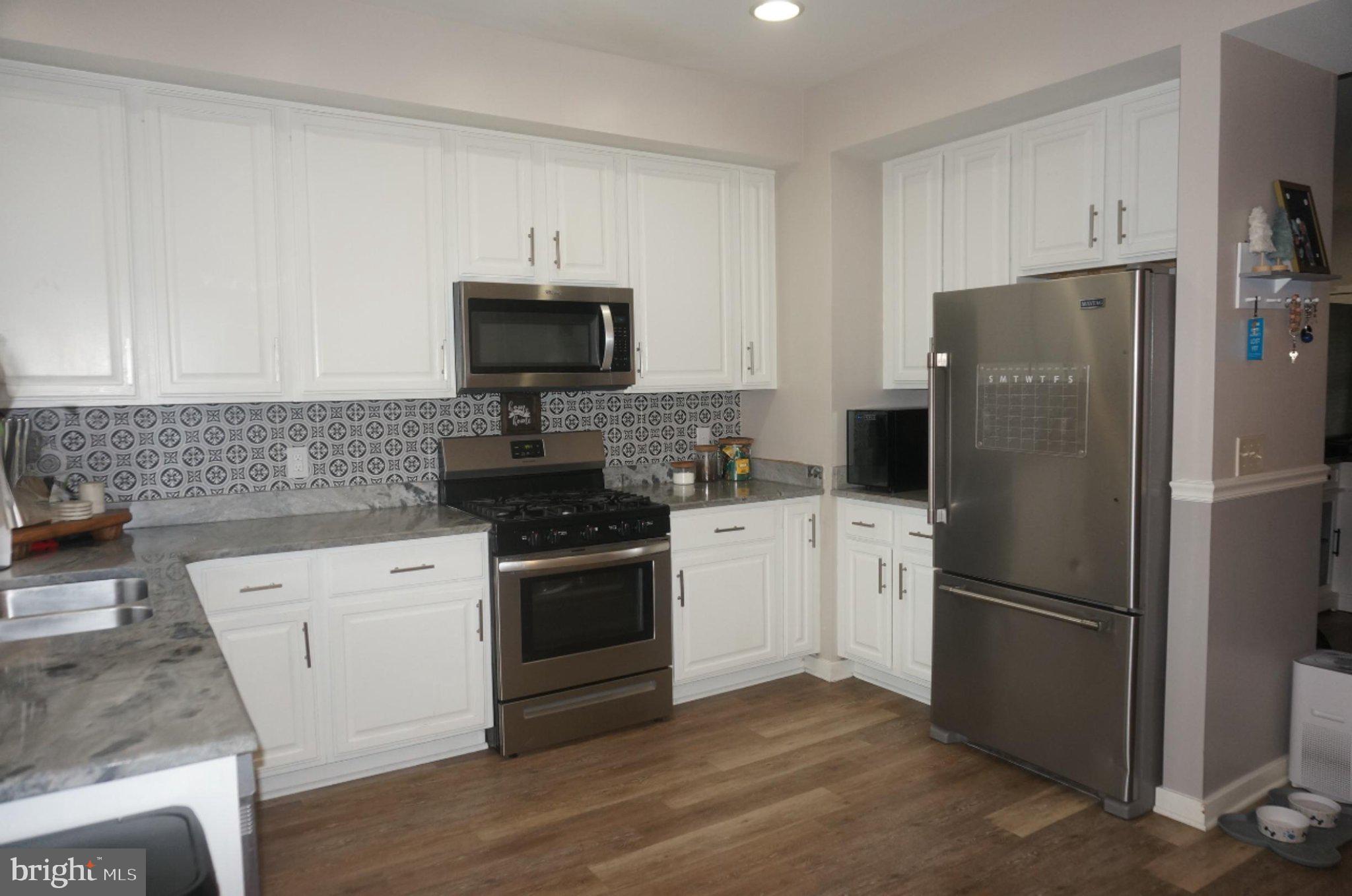 429 Locust Street Lancaster, PA 17602 - Photo 6 of 18 a kitchen with a refrigerator stove and microwave