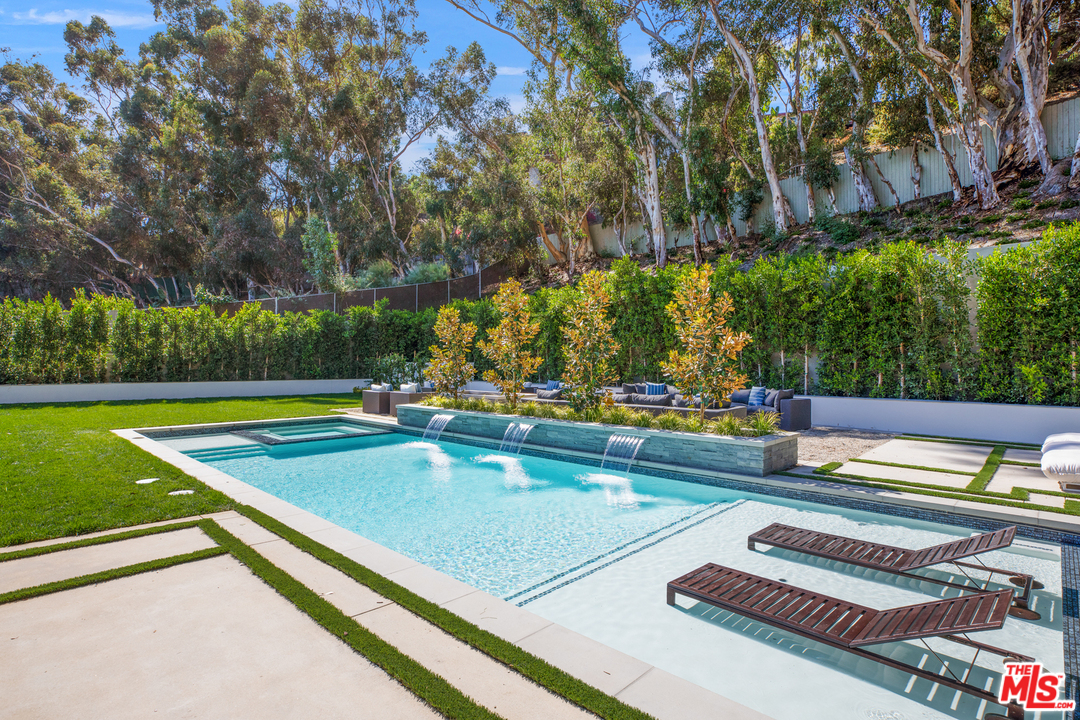 829 Greentree Road Pacific Palisades, CA 90402 - Photo 45 of 50 a view of swimming pool with chairs in outdoor space