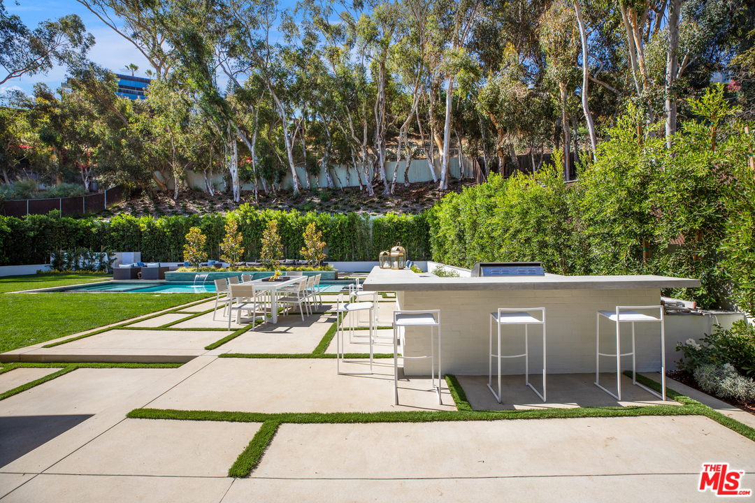 829 Greentree Road Pacific Palisades, CA 90402 - Photo 46 of 50 a view of swimming pool with seating space