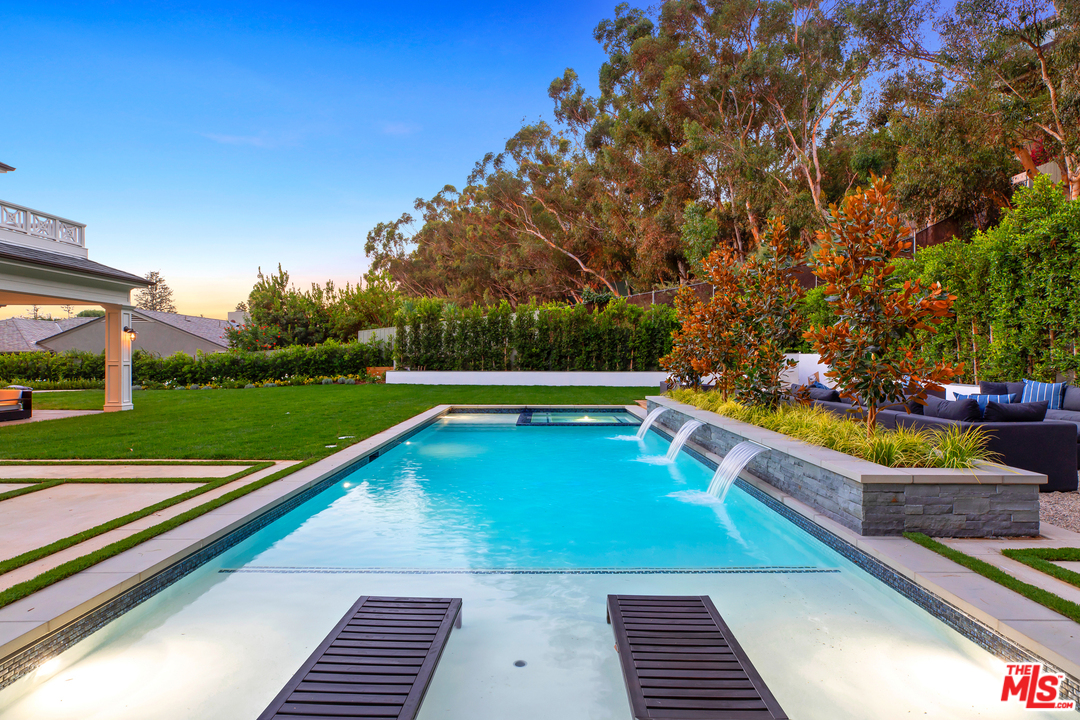 829 Greentree Road Pacific Palisades, CA 90402 - Photo 49 of 50 a view of a yard with swimming pool and outdoor seating