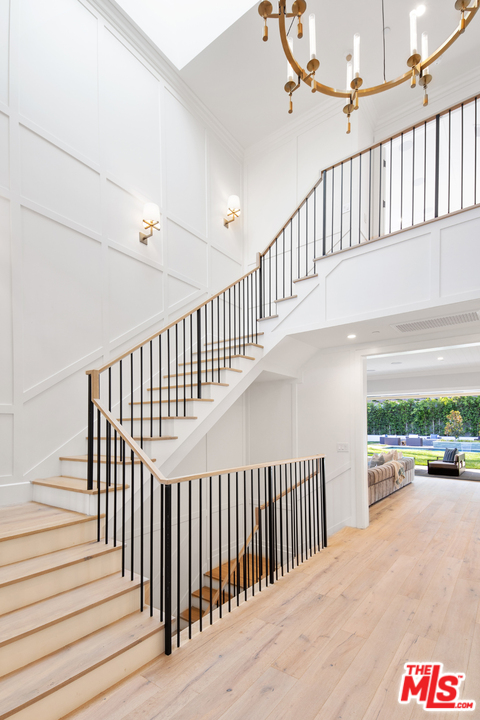829 Greentree Road Pacific Palisades, CA 90402 - Photo 10 of 50 a view of staircase with railing and white walls