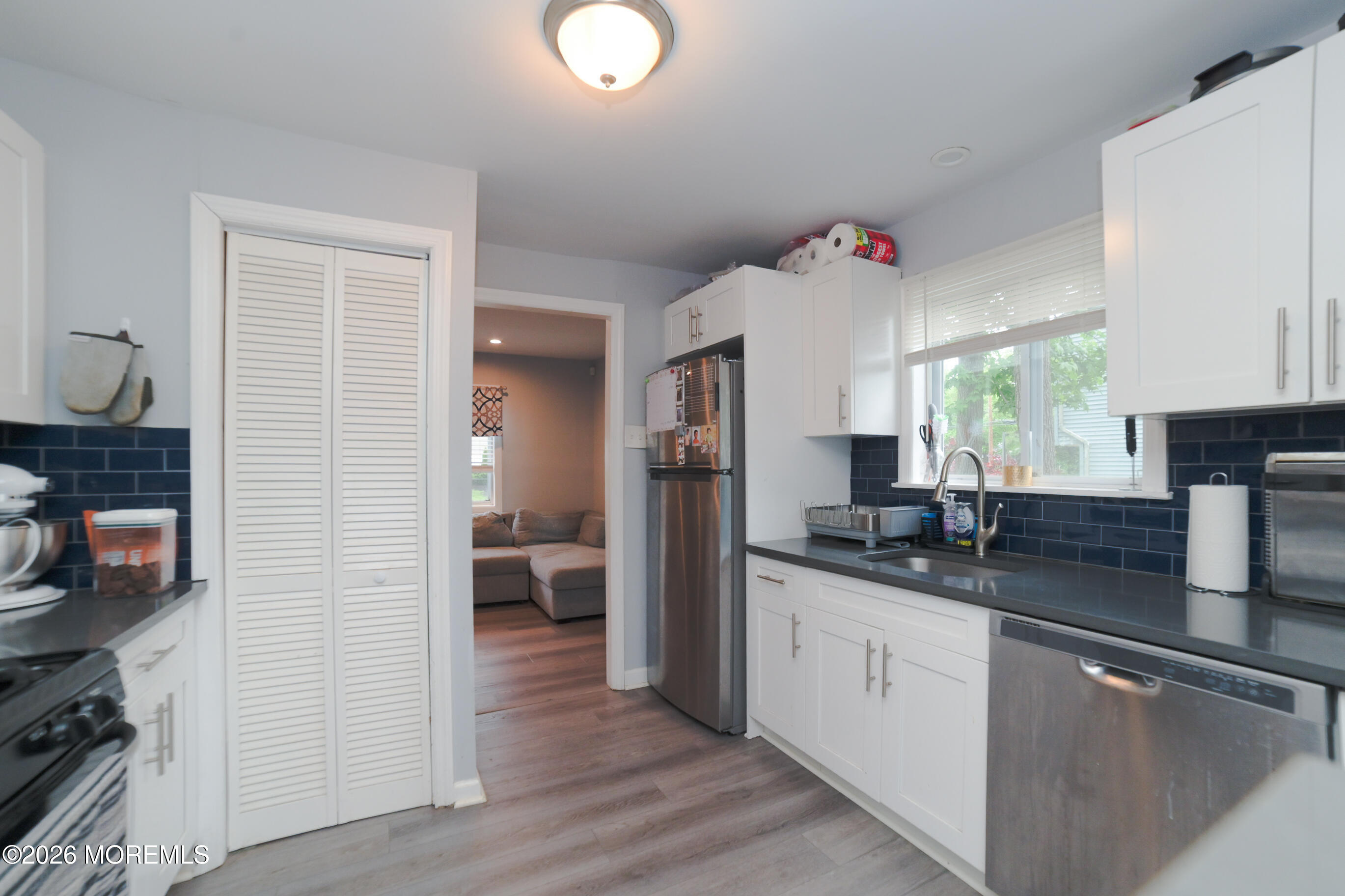 501 Gulden Street Keyport, NJ 07735 - Photo 4 of 14 a kitchen with granite countertop a sink and a stove top oven