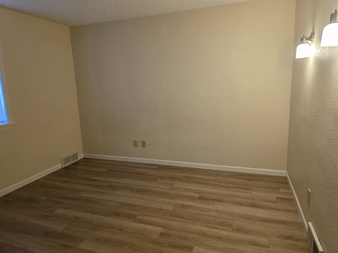 311 Maple Street Prophetstown, IL 61277 - Photo 5 of 9 a view of an empty room with wooden floor
