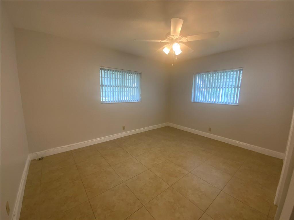 7104 Northwest 70th Street Tamarac, FL 33321 - Photo 18 of 30 an empty room with a window
