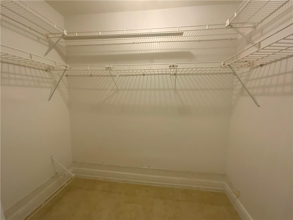 7104 Northwest 70th Street Tamarac, FL 33321 - Photo 23 of 30 a view of a room with racks on the wall