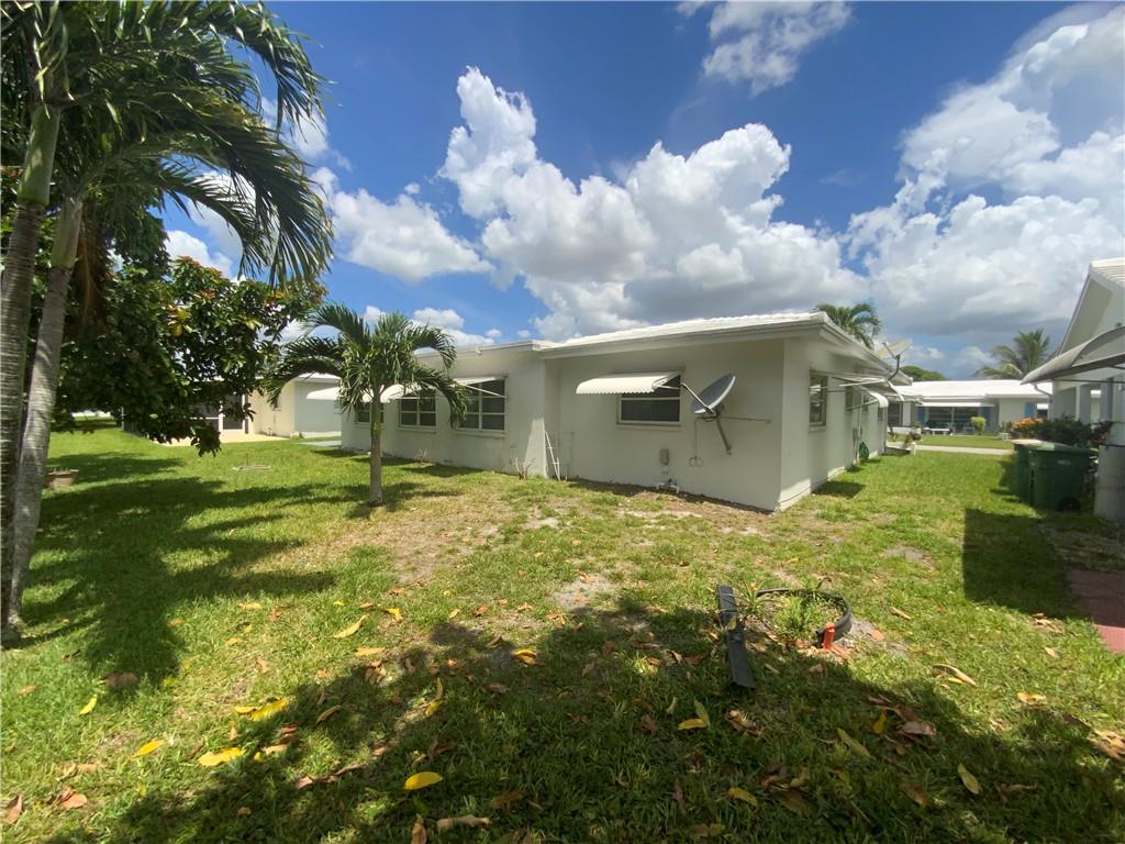 7104 Northwest 70th Street Tamarac, FL 33321 - Photo 29 of 30 a backyard of a house