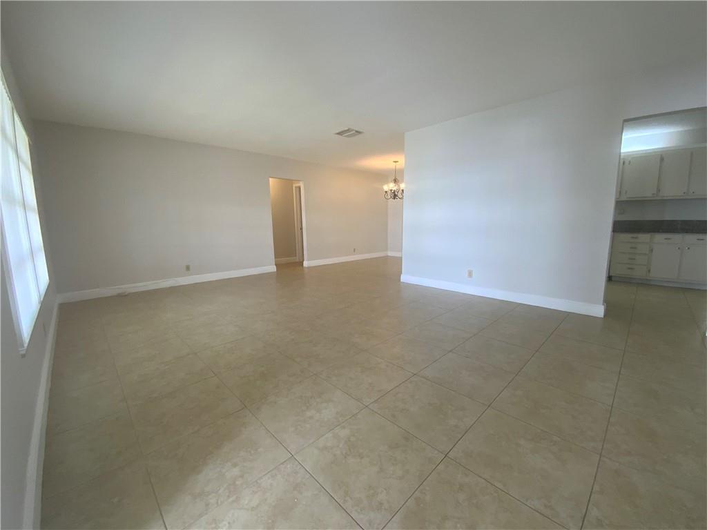 7104 Northwest 70th Street Tamarac, FL 33321 - Photo 5 of 30 an empty room with a natural light