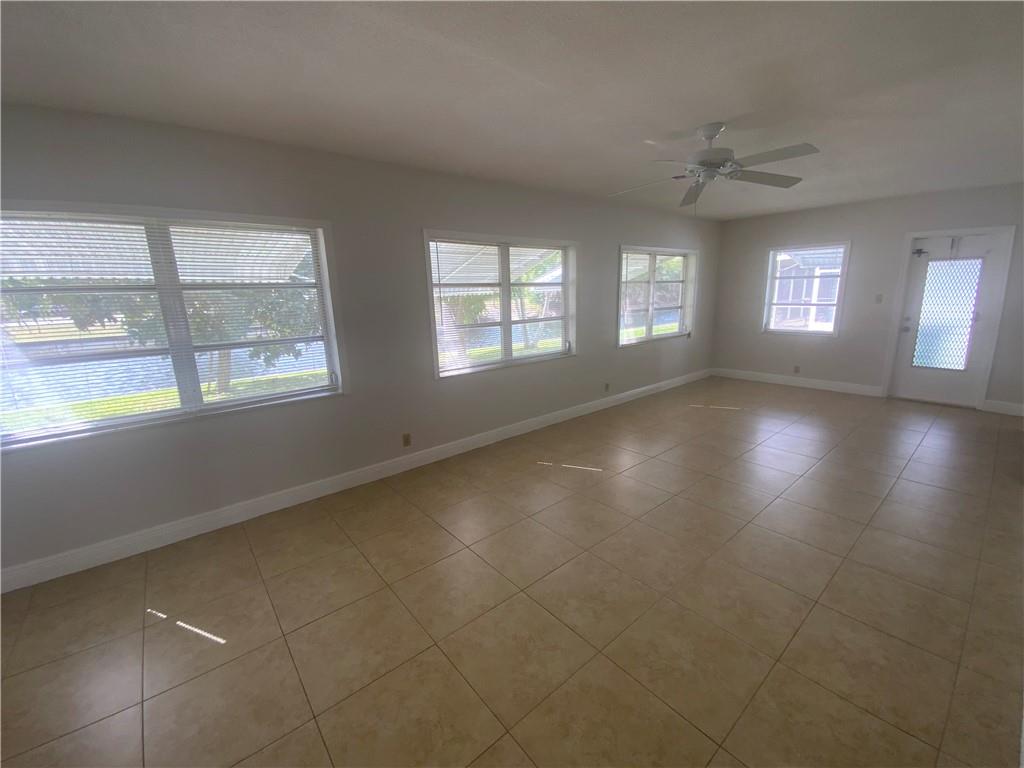 7104 Northwest 70th Street Tamarac, FL 33321 - Photo 10 of 30 a view of an empty room with a window