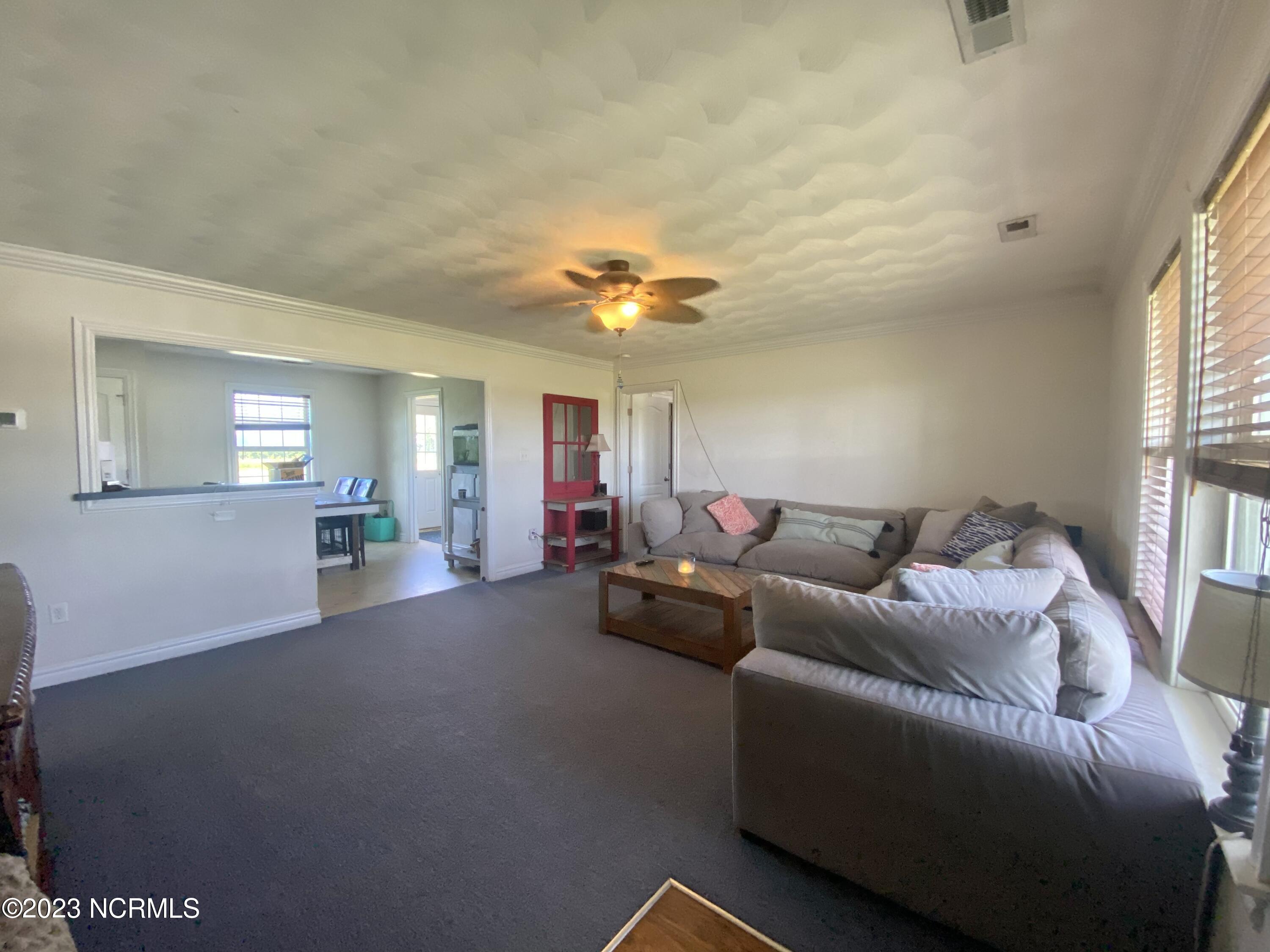 235 South Currituck Road Currituck, NC 27929 - Photo 3 of 11 open living room to kitchen area