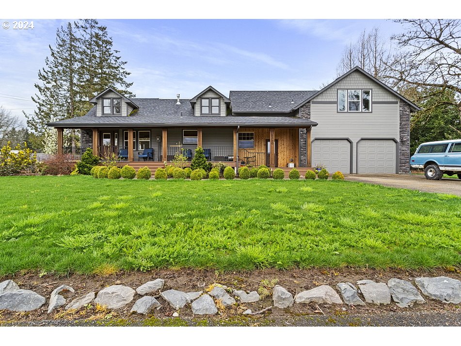5360 Southeast Chase Road Gresham, OR 97080 - Photo 1 of 48 a front view of a house with garden