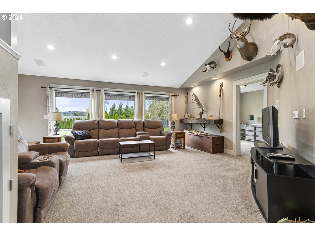 5360 Southeast Chase Road Gresham, OR 97080 - Photo 11 of 48 a living room with furniture a table and a fireplace