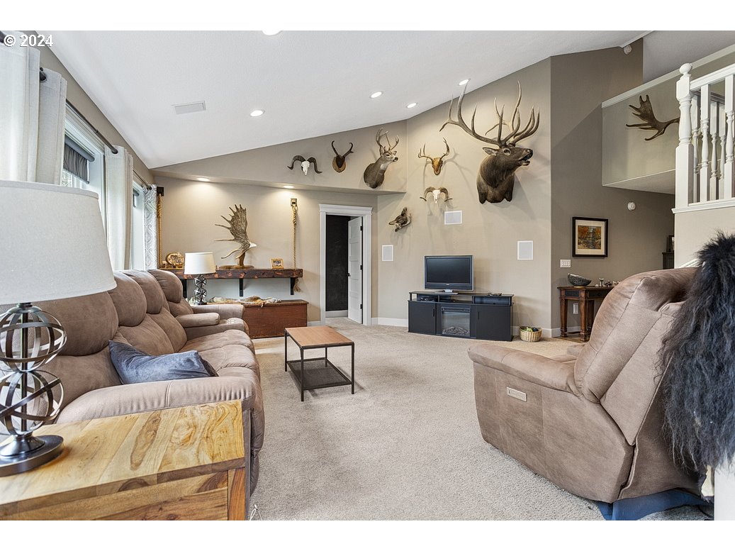 5360 Southeast Chase Road Gresham, OR 97080 - Photo 12 of 48 a living room with furniture and a flat screen tv