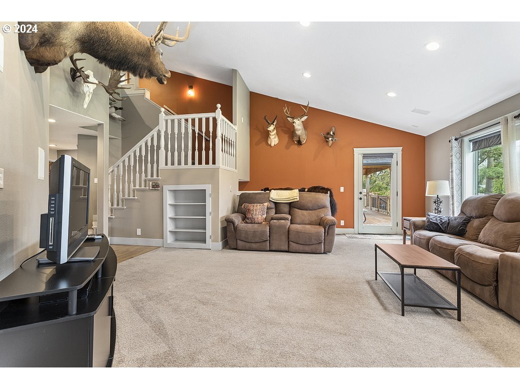 5360 Southeast Chase Road Gresham, OR 97080 - Photo 13 of 48 a living room with furniture and a flat screen tv