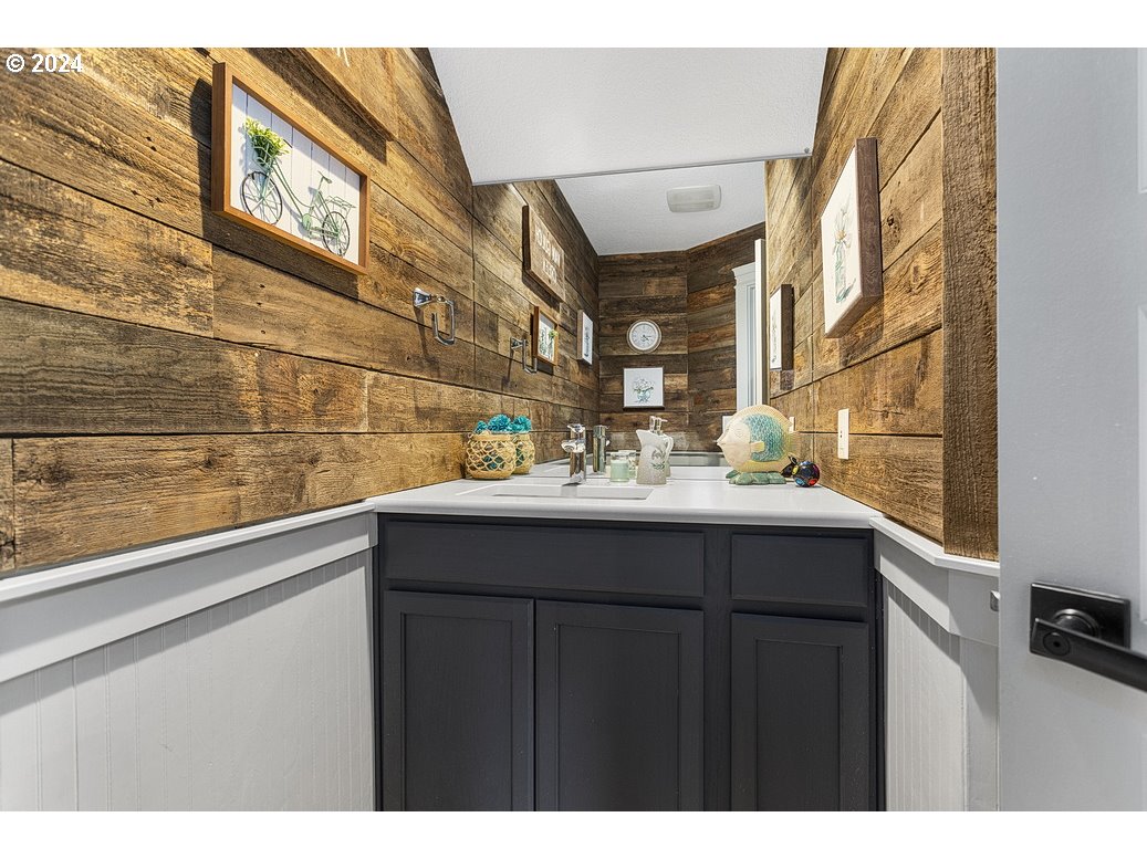 5360 Southeast Chase Road Gresham, OR 97080 - Photo 14 of 48 a bathroom with a sink and a mirror