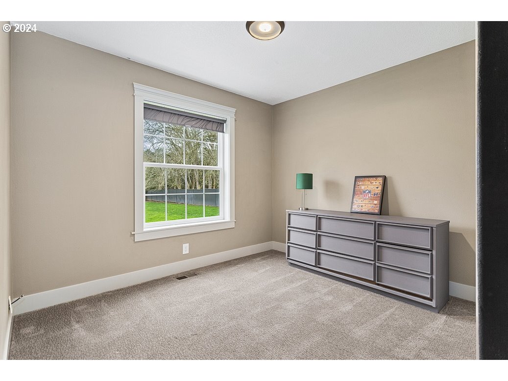 5360 Southeast Chase Road Gresham, OR 97080 - Photo 15 of 48 a wooden bench sitting in a room next to a window