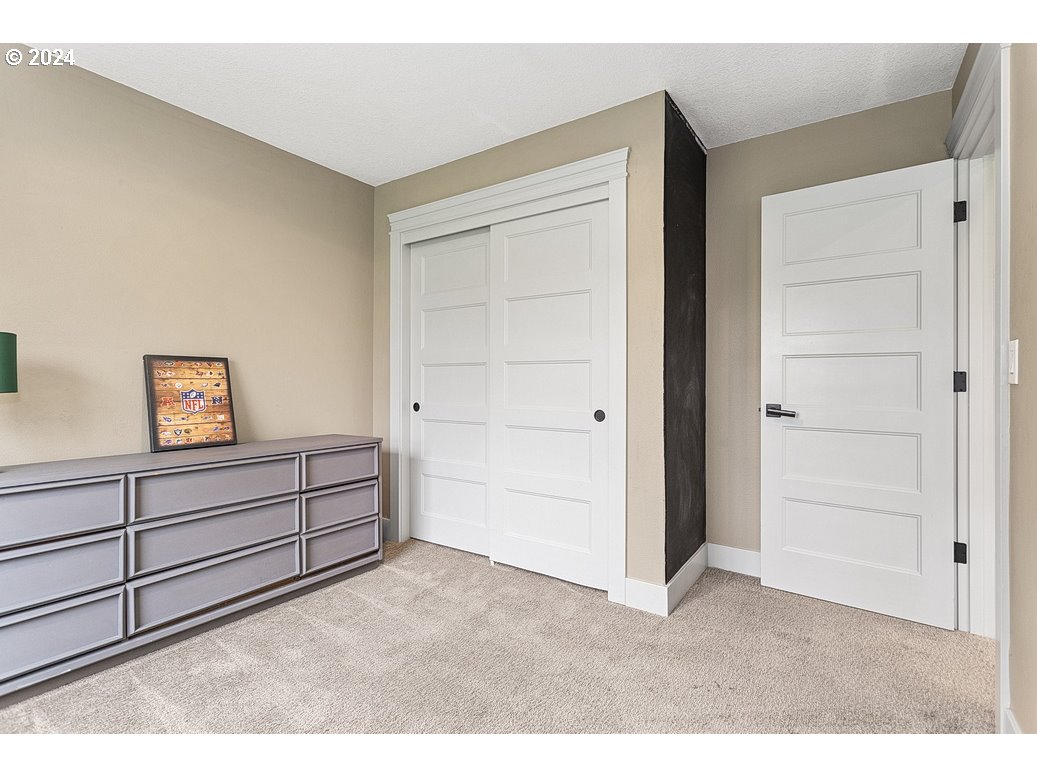 5360 Southeast Chase Road Gresham, OR 97080 - Photo 17 of 48 a bed room with a bed and a dresser