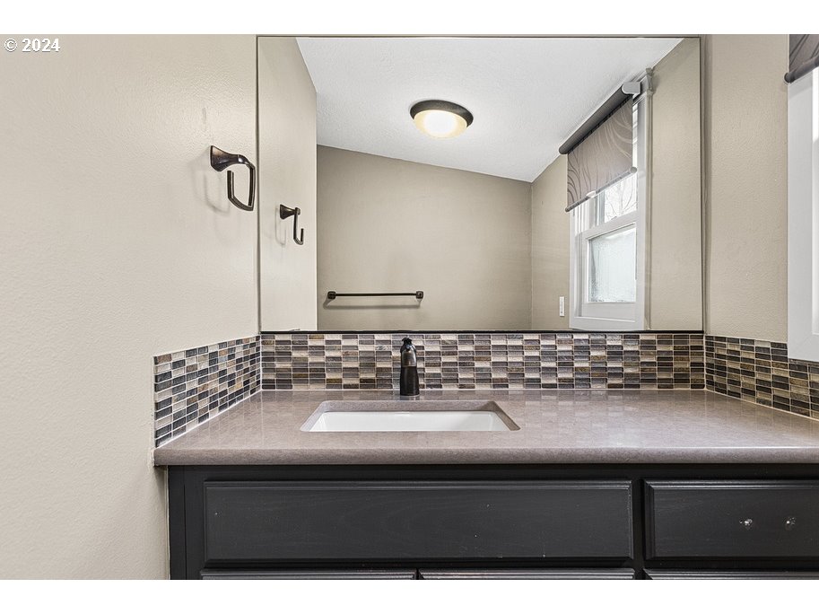 5360 Southeast Chase Road Gresham, OR 97080 - Photo 20 of 48 a bathroom with a sink and a mirror