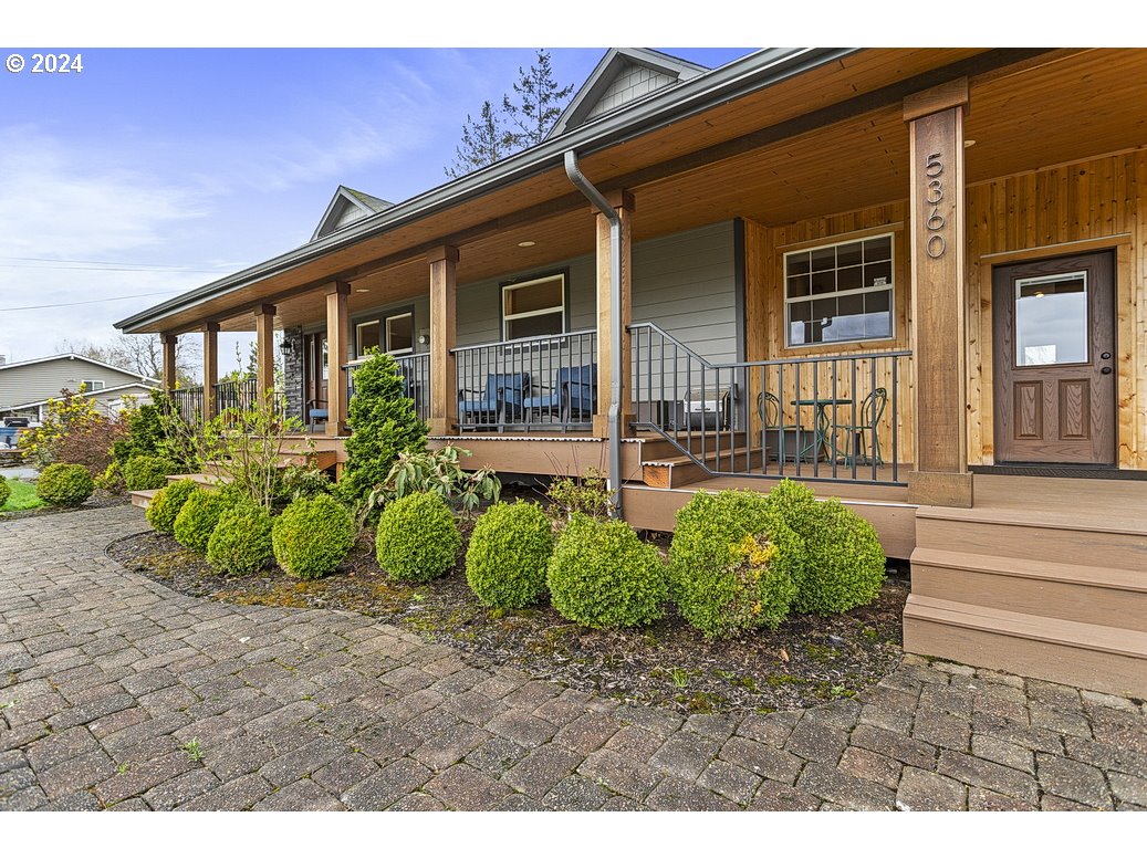 5360 Southeast Chase Road Gresham, OR 97080 - Photo 2 of 48 a front view of a house with garden