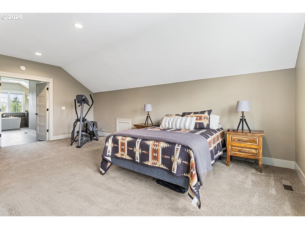 5360 Southeast Chase Road Gresham, OR 97080 - Photo 26 of 48 a spacious bedroom with a bed and a desk