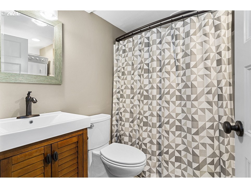 5360 Southeast Chase Road Gresham, OR 97080 - Photo 40 of 48 a bathroom with a sink and a mirror