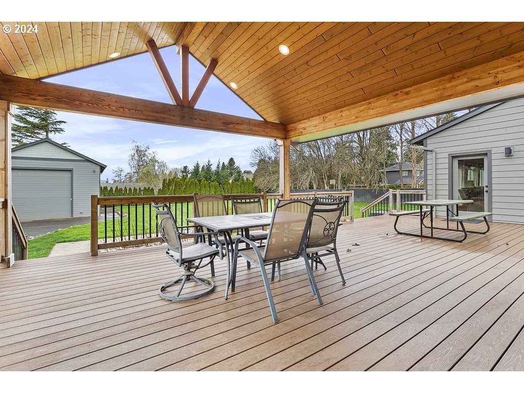 5360 Southeast Chase Road Gresham, OR 97080 - Photo 41 of 48 a view of a chairs and table on the wooden deck