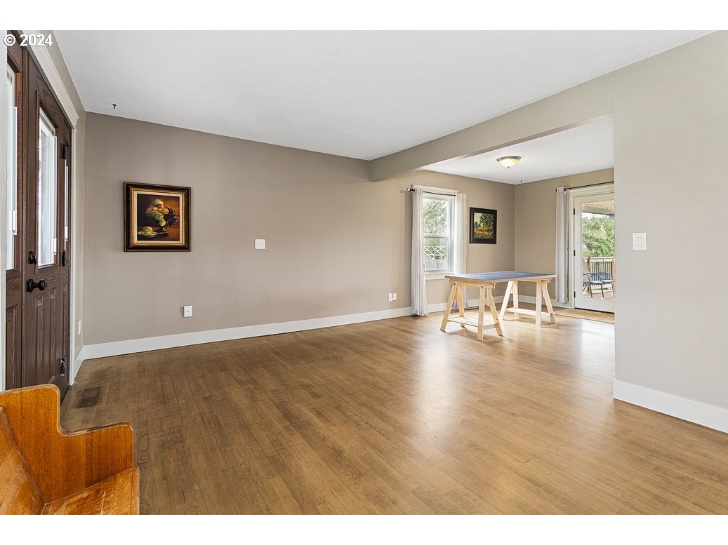 5360 Southeast Chase Road Gresham, OR 97080 - Photo 8 of 48 a view of livingroom and dining room with furniture wooden floor