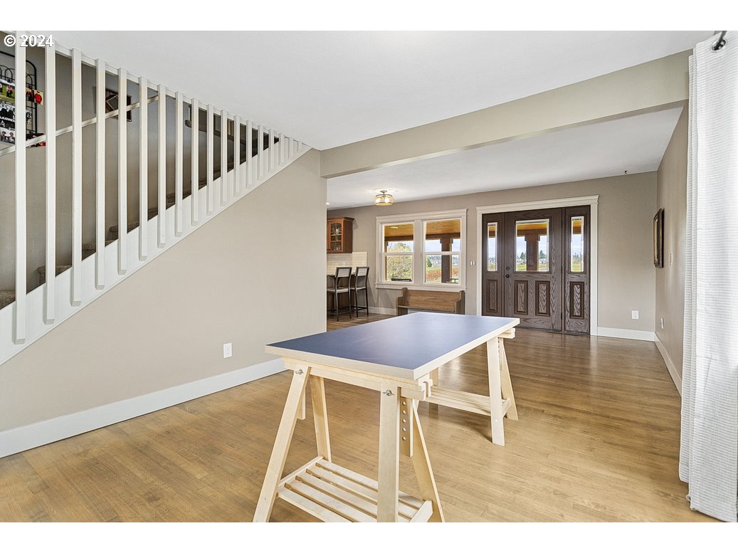 5360 Southeast Chase Road Gresham, OR 97080 - Photo 10 of 48 a dining room with wooden floor and a rug