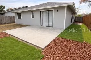 a view of a backyard of the house